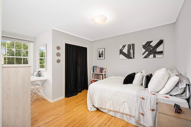 6712 Hillside Ln, Edina, MN 55439 - bedroom featuring wood finished floors and baseboards