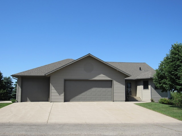 316 8th St NE, Fulda, MN 56131 - ranch-style house featuring a garage, concrete driveway, roof with shingles, and a front yard