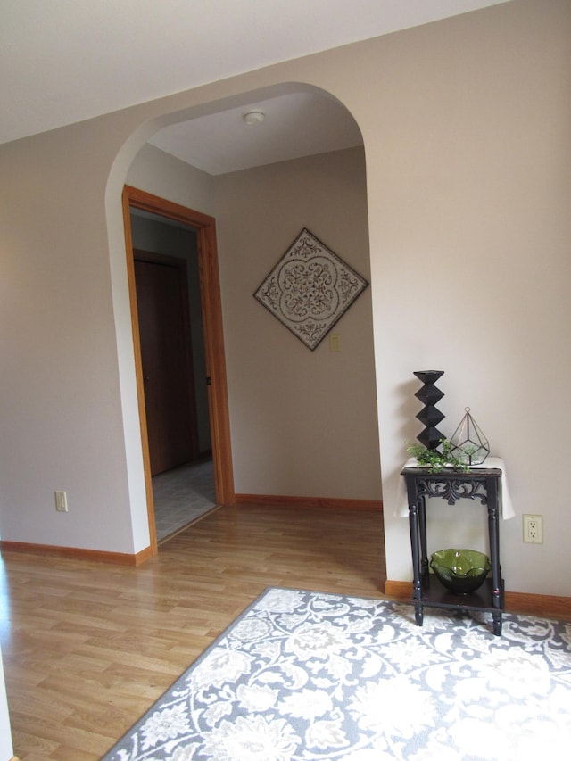 316 8th St NE, Fulda, MN 56131 - hallway featuring arched walkways and light wood-style floors