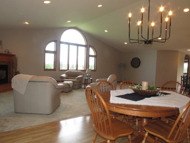316 8th St NE, Fulda, MN 56131 - dining space featuring a chandelier, wood finished floors, lofted ceiling, recessed lighting, and arched walkways