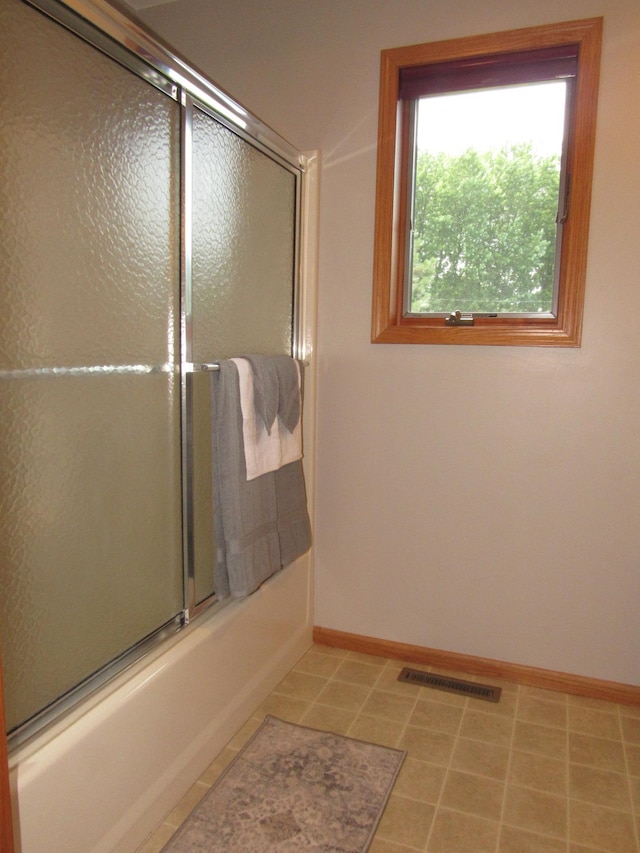 316 8th St NE, Fulda, MN 56131 - full bathroom with baseboards and enclosed tub / shower combo