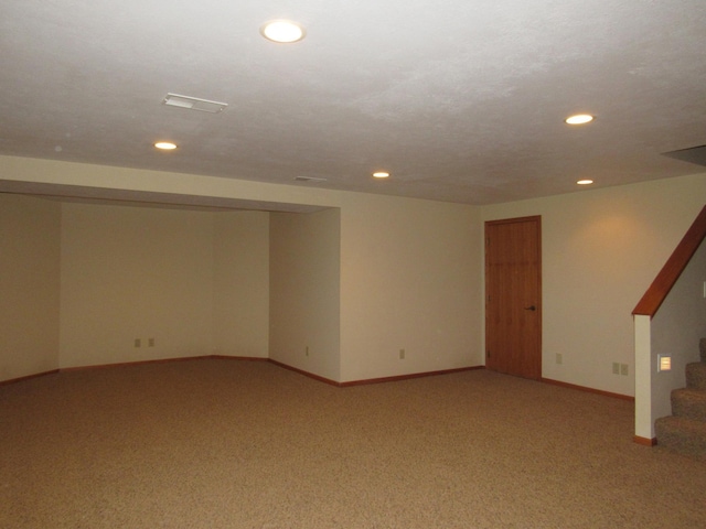 316 8th St NE, Fulda, MN 56131 - finished below grade area featuring stairs, light carpet, and recessed lighting