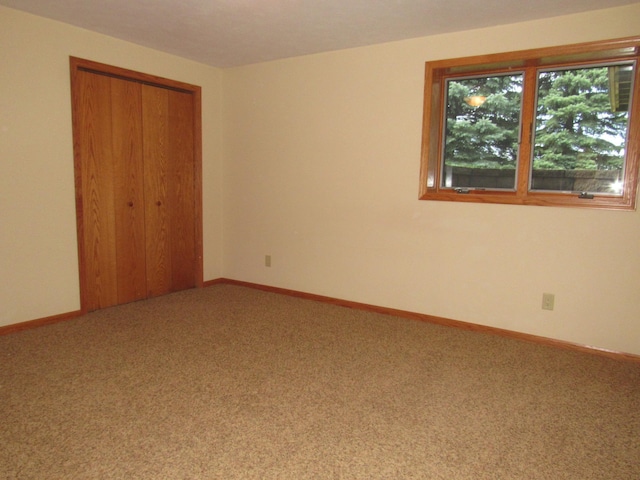 316 8th St NE, Fulda, MN 56131 - unfurnished bedroom featuring carpet flooring and a closet