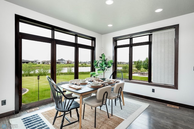 7373 14th St S, Fargo, ND 58104 - dining room with a water view, recessed lighting, and wood finished floors