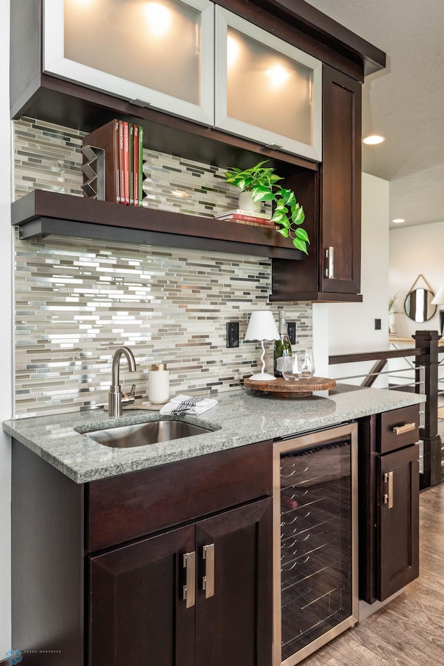 7373 14th St S, Fargo, ND 58104 - indoor wet bar with wine cooler, backsplash, light wood-style floors, and recessed lighting