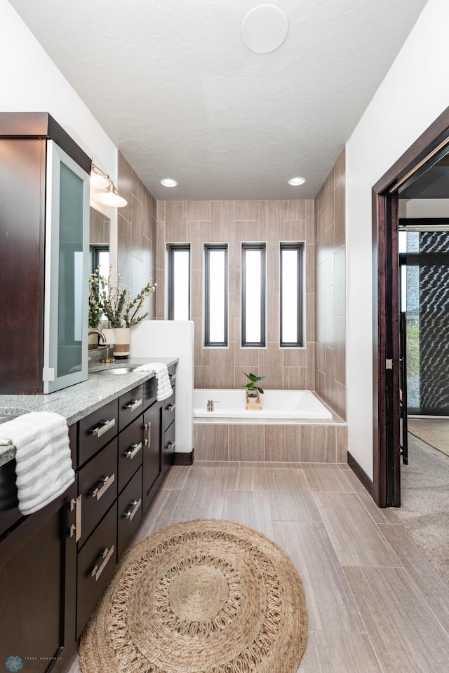 7373 14th St S, Fargo, ND 58104 - full bathroom featuring vanity and a bath
