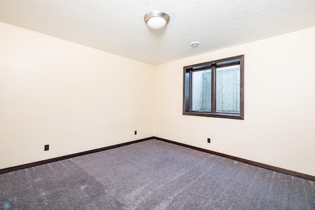 7373 14th St S, Fargo, ND 58104 - carpeted empty room featuring baseboards and a textured ceiling