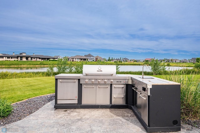 7373 14th St S, Fargo, ND 58104 - view of patio featuring area for grilling, a water view, and a residential view