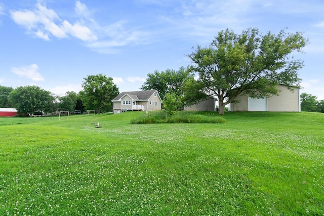 3568 Feldman Ave SE, Buffalo, MN 55313 - view of yard with a garage and an area for sports