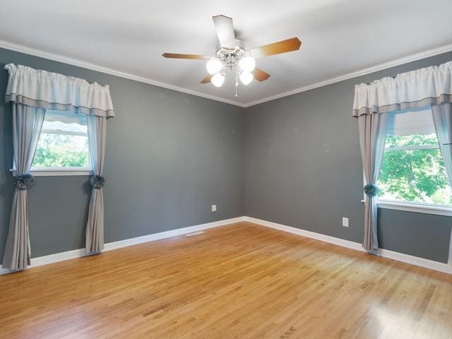 3568 Feldman Ave SE, Buffalo, MN 55313 - unfurnished room featuring light wood-style flooring, ceiling fan, and ornamental molding