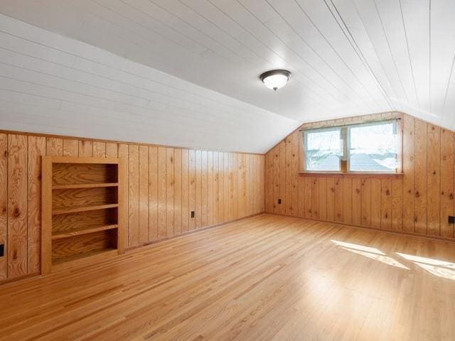 3568 Feldman Ave SE, Buffalo, MN 55313 - additional living space with wood finished floors, wood walls, and lofted ceiling