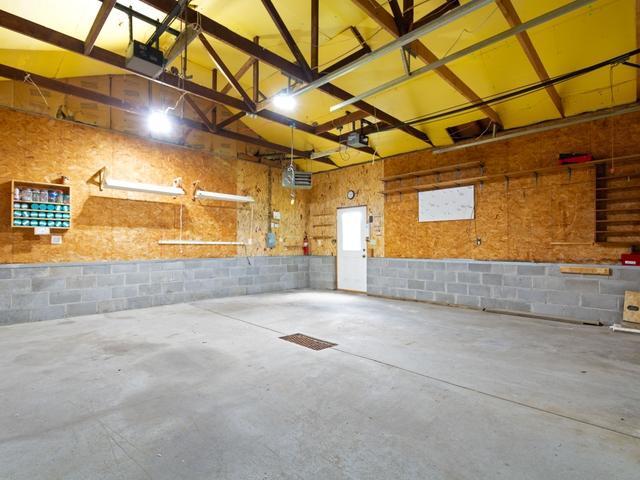 3568 Feldman Ave SE, Buffalo, MN 55313 - garage with concrete block wall and a garage door opener