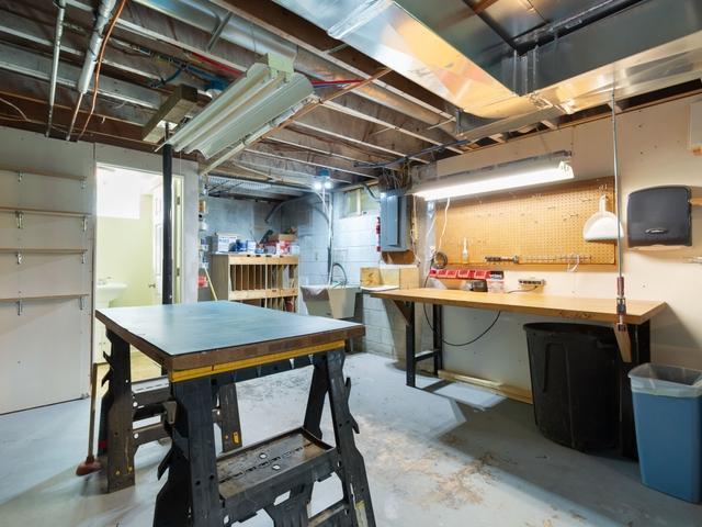 3568 Feldman Ave SE, Buffalo, MN 55313 - unfinished basement with a workshop area and electric panel