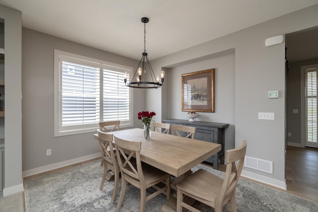 14714 146th Ave N, Dayton, MN 55327 - dining space with a chandelier and baseboards