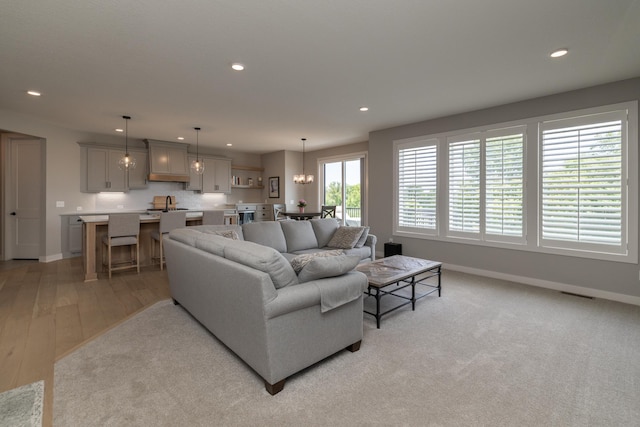 14714 146th Ave N, Dayton, MN 55327 - living room with recessed lighting, light wood-type flooring, and a chandelier