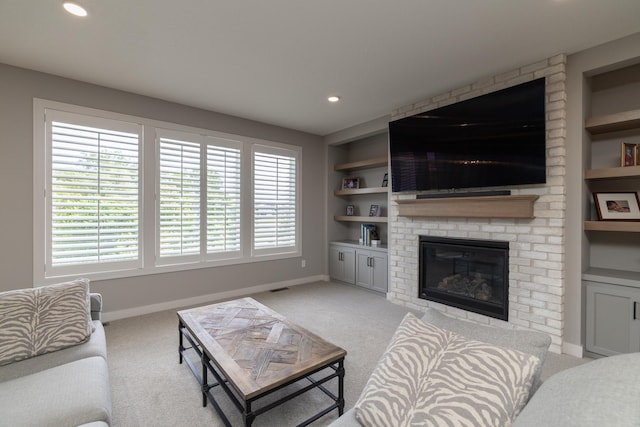 14714 146th Ave N, Dayton, MN 55327 - living room featuring carpet floors, built in features, a brick fireplace, and recessed lighting