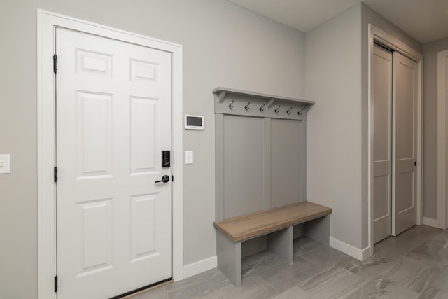 14714 146th Ave N, Dayton, MN 55327 - mudroom featuring baseboards and marble look tile flooring