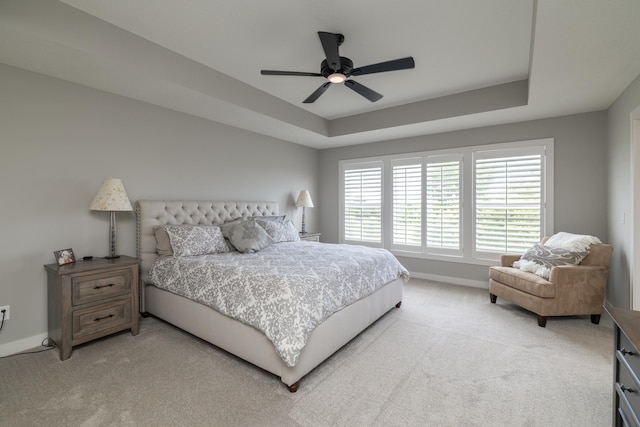 14714 146th Ave N, Dayton, MN 55327 - bedroom with light carpet, a raised ceiling, and ceiling fan