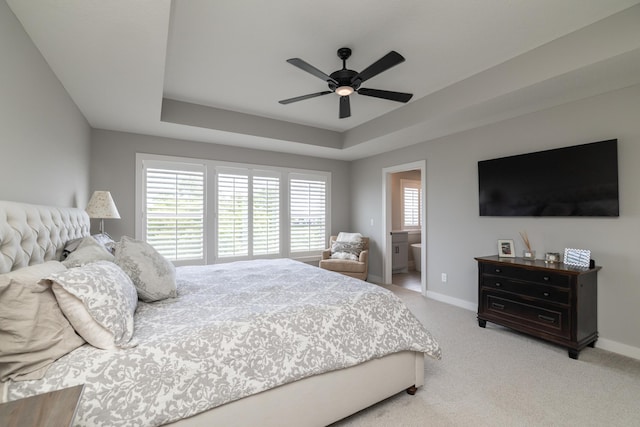 14714 146th Ave N, Dayton, MN 55327 - bedroom featuring a raised ceiling, light carpet, and ceiling fan