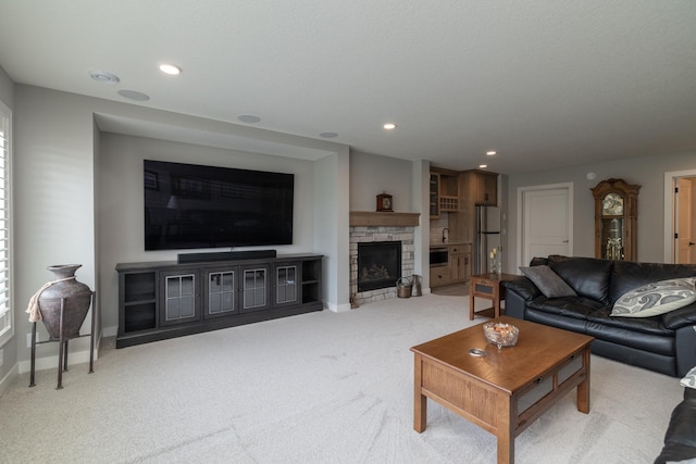 14714 146th Ave N, Dayton, MN 55327 - living area featuring light colored carpet, a fireplace, and recessed lighting
