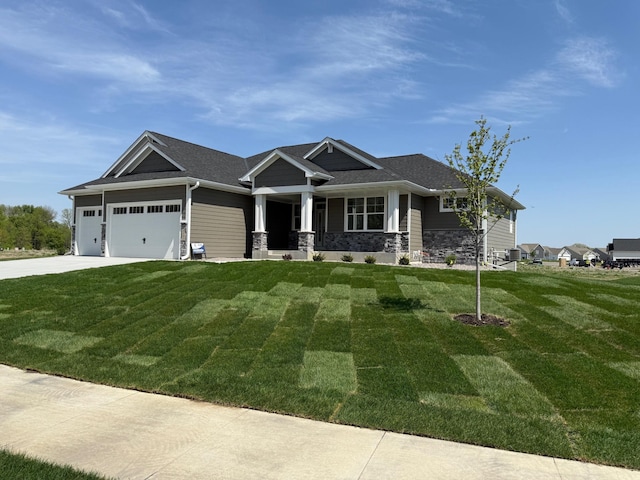 14147 77th Ln NE, Otsego, MN 55330 - view of front facade featuring a garage, a front yard, concrete driveway, and stone siding
