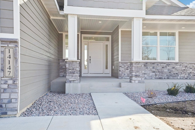 14147 77th Ln NE, Otsego, MN 55330 - entrance to property featuring stone siding and a porch