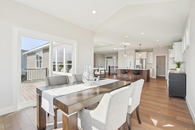 14147 77th Ln NE, Otsego, MN 55330 - dining area with light wood-type flooring, recessed lighting, and lofted ceiling