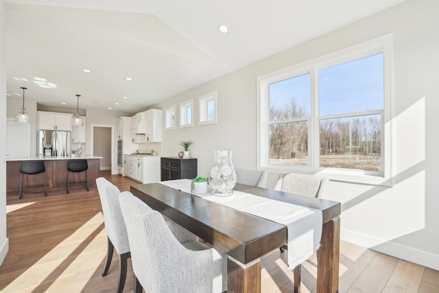 14147 77th Ln NE, Otsego, MN 55330 - dining area with light wood finished floors, recessed lighting, and lofted ceiling