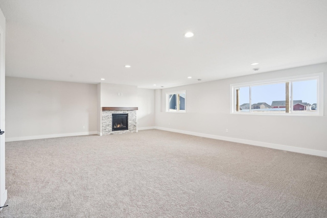 14147 77th Ln NE, Otsego, MN 55330 - unfurnished living room featuring a fireplace, recessed lighting, and carpet floors