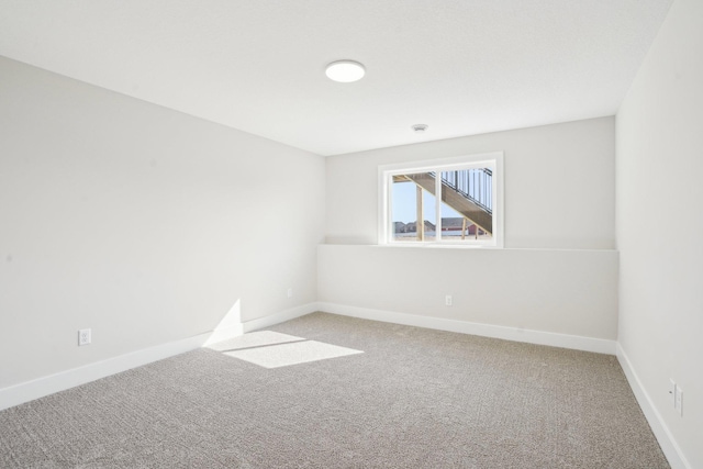 14147 77th Ln NE, Otsego, MN 55330 - carpeted spare room with baseboards and a smoke detector