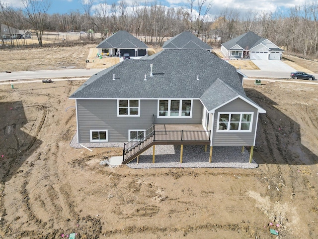 14147 77th Ln NE, Otsego, MN 55330 - rear view of property featuring a shingled roof, stairs, and a deck