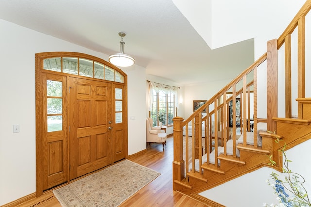 160 River Bluff Pl NW, Cascade Twp, MN 55901 - foyer featuring stairs and light wood-style flooring