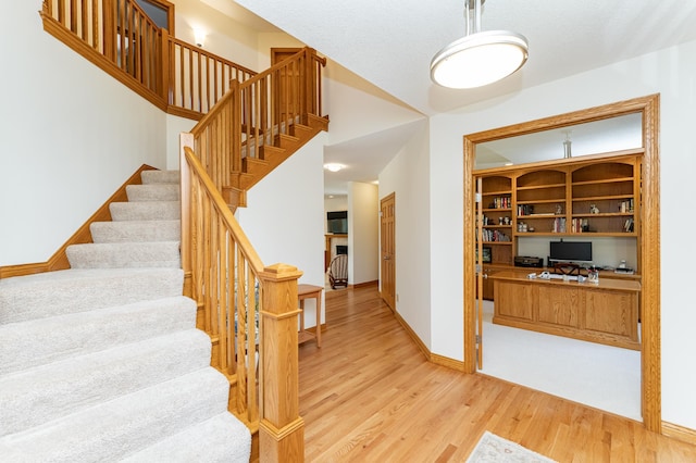 160 River Bluff Pl NW, Cascade Twp, MN 55901 - stairway featuring wood finished floors and baseboards