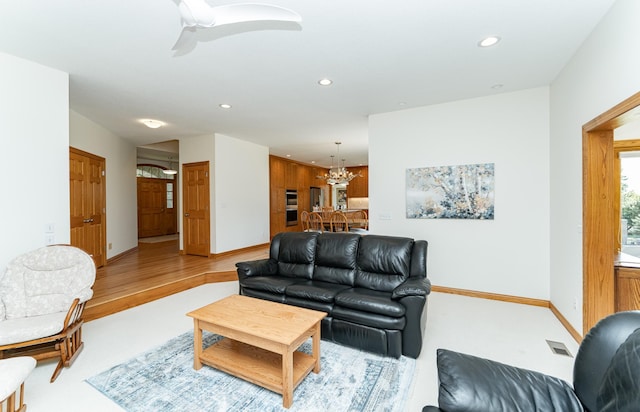 160 River Bluff Pl NW, Cascade Twp, MN 55901 - living room with a chandelier, recessed lighting, and ceiling fan
