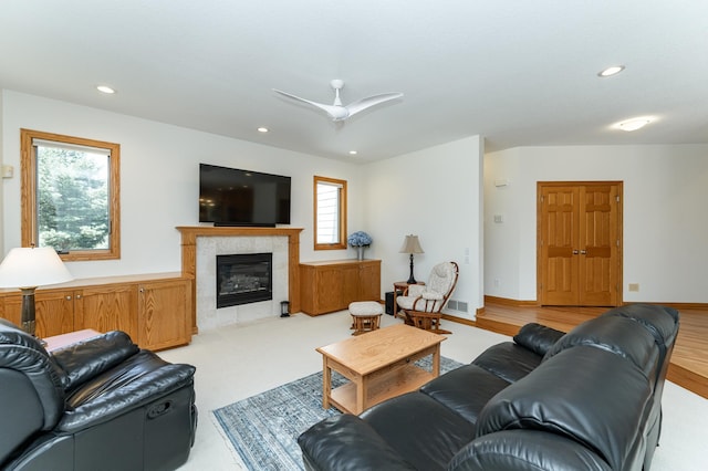 160 River Bluff Pl NW, Cascade Twp, MN 55901 - living room featuring a tiled fireplace and recessed lighting
