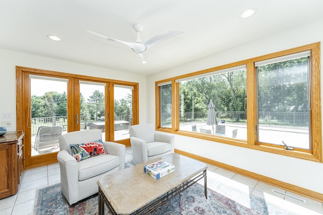 160 River Bluff Pl NW, Cascade Twp, MN 55901 - living room with french doors, light tile patterned floors, ceiling fan, and recessed lighting
