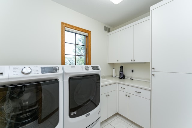 160 River Bluff Pl NW, Cascade Twp, MN 55901 - laundry area featuring washing machine and dryer, cabinet space, and light tile patterned flooring