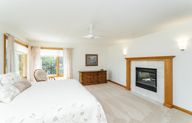 160 River Bluff Pl NW, Cascade Twp, MN 55901 - bedroom featuring carpet flooring, a tiled fireplace, and ceiling fan