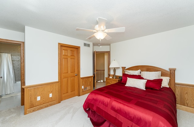160 River Bluff Pl NW, Cascade Twp, MN 55901 - carpeted bedroom with wainscoting, wooden walls, and ceiling fan