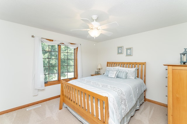 160 River Bluff Pl NW, Cascade Twp, MN 55901 - bedroom with light colored carpet and a ceiling fan