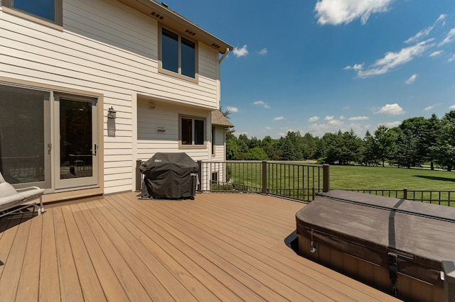 160 River Bluff Pl NW, Cascade Twp, MN 55901 - wooden deck featuring a covered hot tub, grilling area, and a lawn