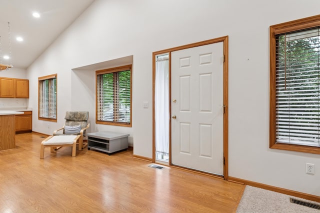 3406 Eagan Oaks Ct, Eagan, MN 55123 - entrance foyer with light wood finished floors, recessed lighting, and high vaulted ceiling