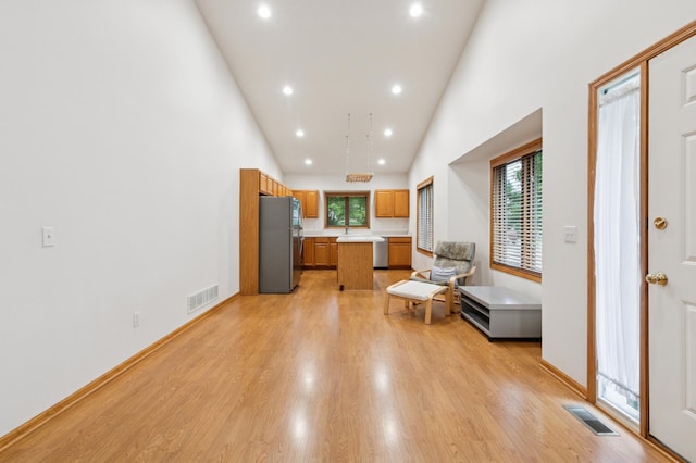 3406 Eagan Oaks Ct, Eagan, MN 55123 - living area with high vaulted ceiling, healthy amount of natural light, light wood finished floors, and recessed lighting