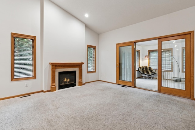 3406 Eagan Oaks Ct, Eagan, MN 55123 - unfurnished living room featuring carpet, high vaulted ceiling, and a glass covered fireplace