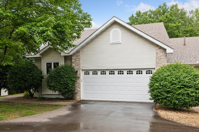 3406 Eagan Oaks Ct, Eagan, MN 55123 - view of front of property with roof with shingles, asphalt driveway, and a garage