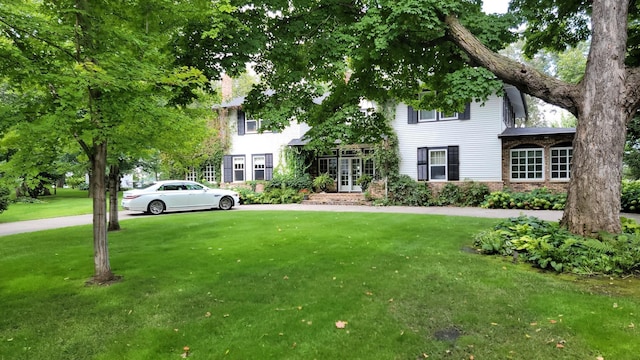 3307 Nokomis NE, Alexandria, MN 56308 - view of front of home with a front yard and brick siding