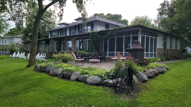 3307 Nokomis NE, Alexandria, MN 56308 - back of property featuring brick siding, a patio area, a yard, and a chimney