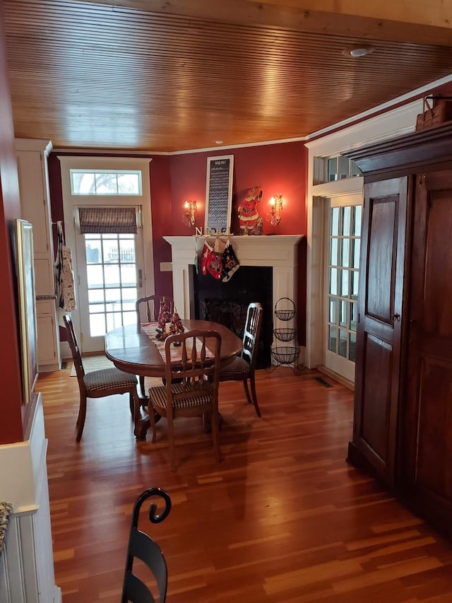 3307 Nokomis NE, Alexandria, MN 56308 - dining space with a fireplace with flush hearth, wooden ceiling, and light wood finished floors