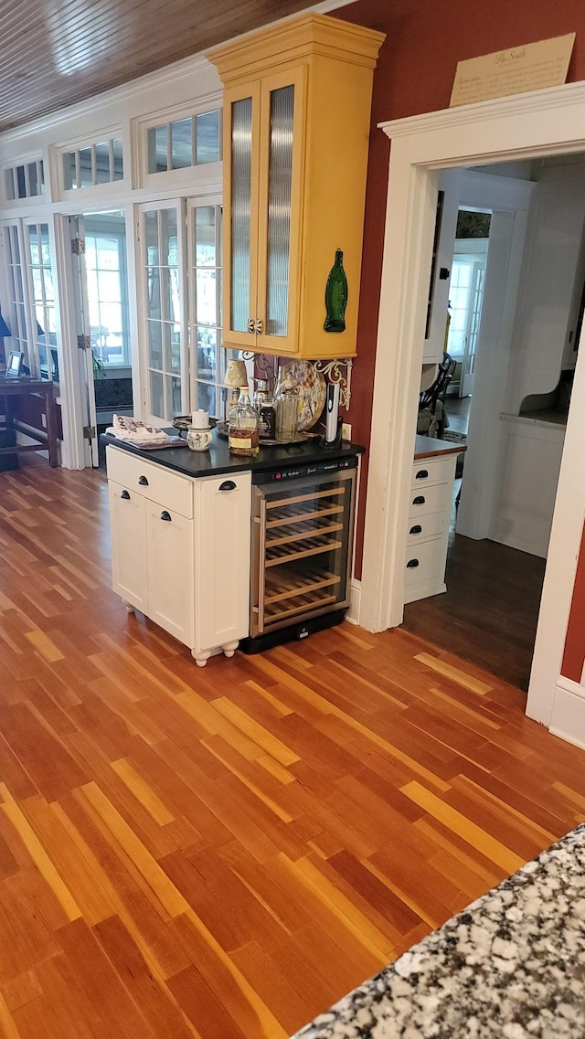 3307 Nokomis NE, Alexandria, MN 56308 - indoor dry bar with wine cooler and light wood-type flooring