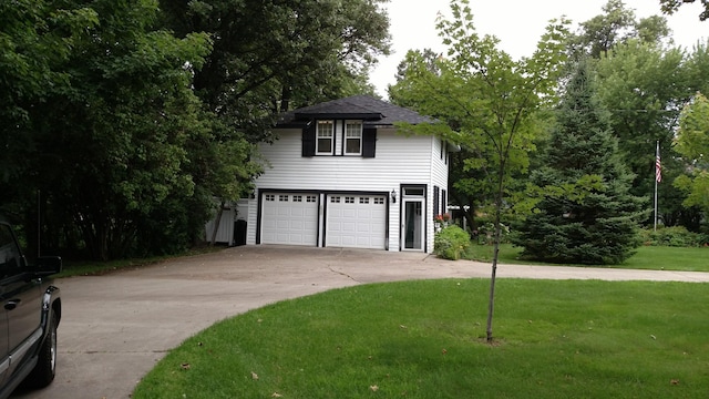3307 Nokomis NE, Alexandria, MN 56308 - traditional-style home with driveway, an attached garage, and a front yard